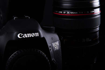 ISTANBUL, TURKEY - JANUARY 04, 2014: Photo of Canon containing 7D body and  24-105mm zoom lens on dark background.のeditorial素材