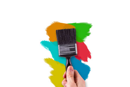 Hand painting on white wall with colorful variations.の写真素材