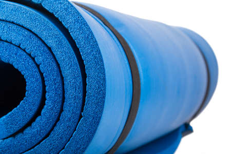 Blue pilates mat, isolated on white background.の写真素材