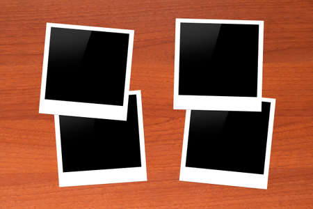 Blank, black picture frames with copy space on wooden table.の写真素材