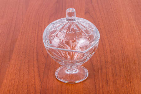Empty glass bowl on wooden table.の写真素材