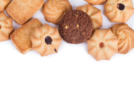 Heap of cookie chips with copy space, isolated on white background.の写真素材