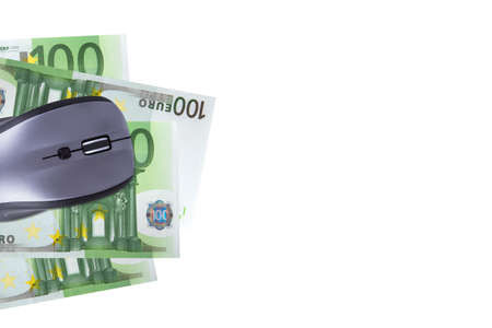 Finance concept, euro banknotes under computer mouse with copy space for your design, isolated on white background.の写真素材