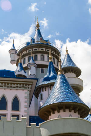 Close up view of fairytale castle in park on cloudy background.のeditorial素材
