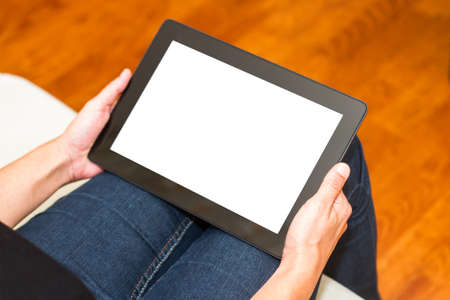 Technology concept. Woman hands holding tablet with blank, white screen.の写真素材