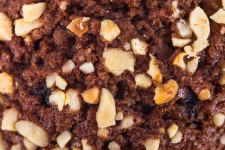 Detail, macro view of cup cake with chocolate as background.の写真素材