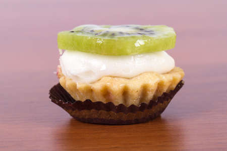 Side view of kiwi tasty cake, isolated on white background.の写真素材