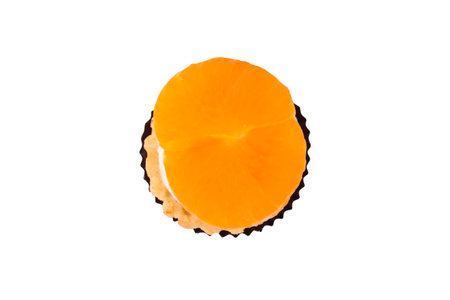 Top view of single mandarin tasty cake, isolated on white background.