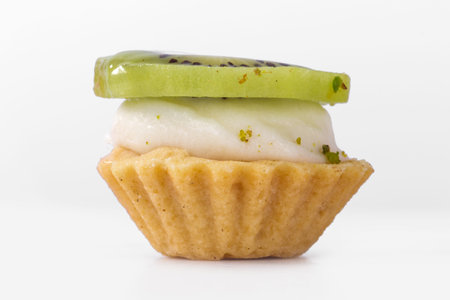 Front view of single kiwi tasty cake, isolated on white background.の写真素材