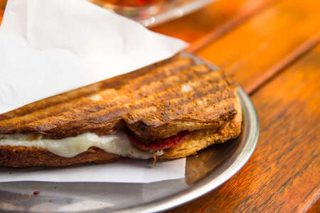 Close up view of toast on plate on wooden table.の写真素材