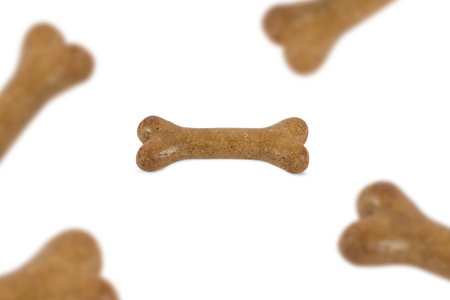 Top view of dog food treats falling, dropping down, isolated on white background.