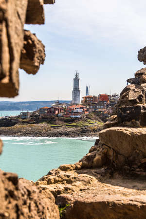Rumeli lighthouse from stairs of castle at seascape on cloudy sky.のeditorial素材