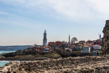 Rumeli lighthouse and village from castle on cloudy sky.のeditorial素材