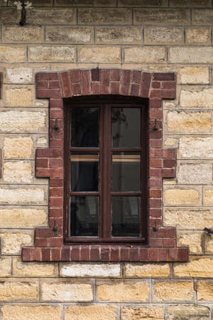 Front view of old window of stone building.の写真素材