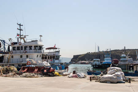 ISTANBUL, TURKEY - APRIL 12, 2015: Front view of fishing boats, fishermen with their nets and ropes.のeditorial素材