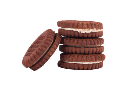 Close up detailed front view of four creamy sadwich biscuits with cacao, isolated on white...