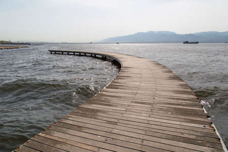 Close up front view of wooden path, bridge inside sea.の写真素材