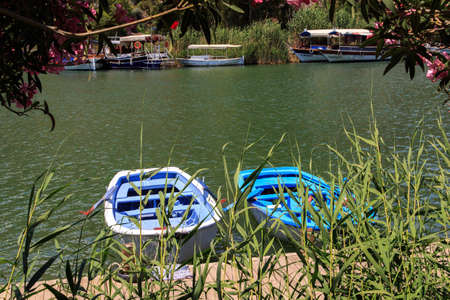 DALYAN, TURKEY - MAY 31, 2015 : Boats for touristic boat trips in the river between Koycegiz Lake and Iztuzu Beach in Dalyan.のeditorial素材
