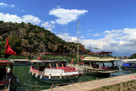 DALYAN, TURKEY - MAY 31, 2015 : Boats for touristic boat trips in the river between Koycegiz Lake and Iztuzu Beach in Dalyan.のeditorial素材
