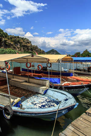 DALYAN, TURKEY - MAY 31, 2015 : Boats for touristic boat trips in the river between Koycegiz Lake and Iztuzu Beach in Dalyan.のeditorial素材