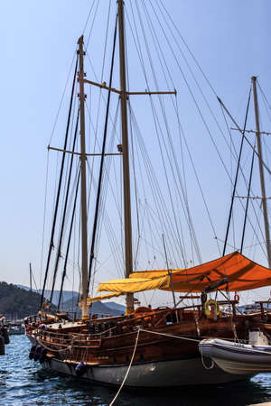 MUGLA, TURKEY - JUNE 1, 2015 : Sailboats anchored on harbor, ships in Marmaris Marina, on blue sky background.のeditorial素材