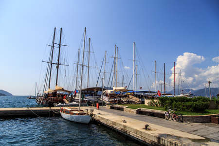 MUGLA, TURKEY - JUNE 1, 2015 : Sailing ships anchored on harbor of Marmaris marina, on blue sky background.のeditorial素材