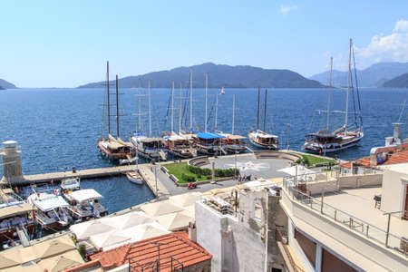 MUGLA, TURKEY - JUNE 1, 2015 : Top view of Marmaris Marina among mountains with sailing boats and yatches anchored, on blue sky background.のeditorial素材