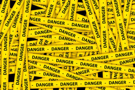 Yellow caution tape strips with text of danger, on black background.の写真素材
