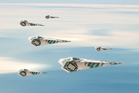 Flying paper planes with dollar banknotes, on blue cloudy sky background.の写真素材