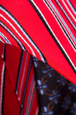 Close up detailed view of multicolored striped and checkered men ties as background.の写真素材