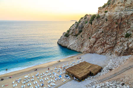ANTALYA, TURKEY - JULY 17, 2015 : Top view of famous canyon junction beach of Antalya, Kaputas Beach with its turquoise water color, view of people swimming and sunbathing at sunset background.のeditorial素材