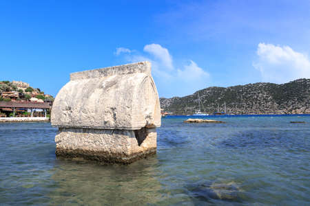 DEMRE, ANTALYA - JULY 18, 2015 : Seascape of Kekova Ancient Lycian City in Antalya, with a big sarcophagus in the sea, on bright blue sky background.のeditorial素材