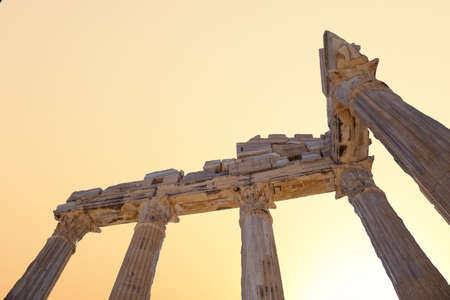 Close up detailed view of the columns of Side Ancient City, in Antalya which is thought to be built before 7th century bc, on sunrise or sunset background.の写真素材