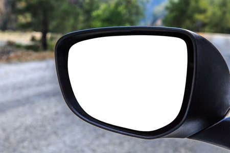 Close up front view of rearview mirror of a car with blank copy space, on road scene background.の写真素材