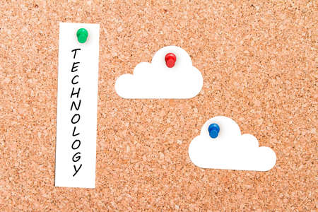 Close up front view of illustrative corkboard with clouds and technology text on white note card pinned with colorful pins, on pinboard background.の写真素材