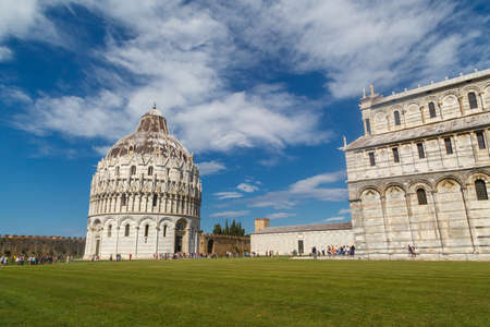 PISA , ITALY - SEPTEMBER 21, 2015 : View of historical old Pisa Cathedral in Cathedral Square in Pisa, Italy, on cloudy blue sky background.のeditorial素材