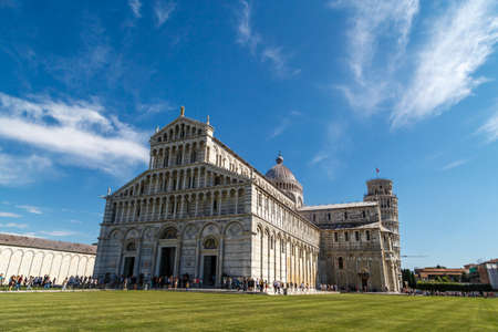 PISA , ITALY - SEPTEMBER 21, 2015 : View of historical old Pisa Cathedral in Cathedral Square in Pisa, Italy, on cloudy blue sky background.のeditorial素材