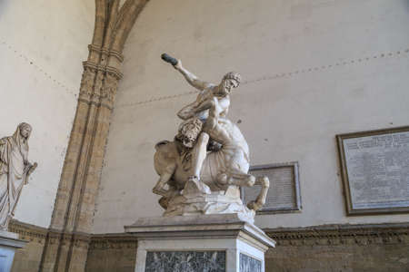 Close up view of historical granit sculptures of man fighting at Piazza Della Signoria in Florence.のeditorial素材