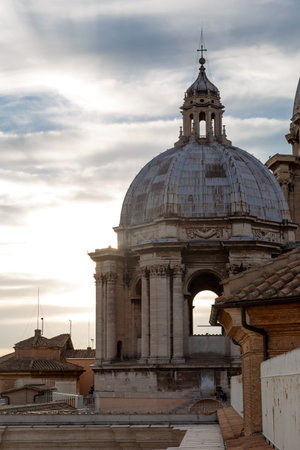 Close up detailed dome view of Saint Peter's Basilica in Vatican, on cloudy blue sky background.の写真素材