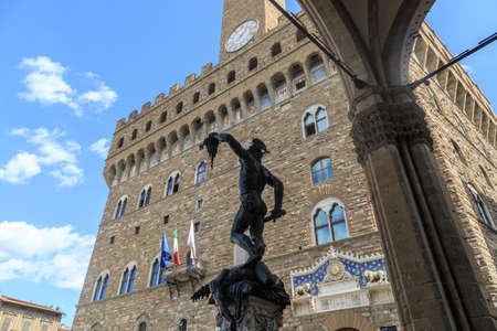View of Piazza Della Signoria in Florence, with historical sculptures around, on cloudy blue sky background.のeditorial素材