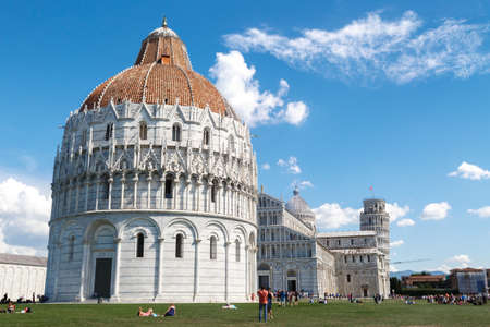 PISA, ITALY - SEPTEMBER 21, 2015 : View of Baptisery building in Cathedral Square in Pisa, Italy, on cloudy blue sky background.のeditorial素材