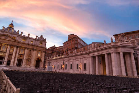 Front view of St Peter's Basilica in Vatican with people around, on cloudy blue sky backgroundat sunset time.のeditorial素材