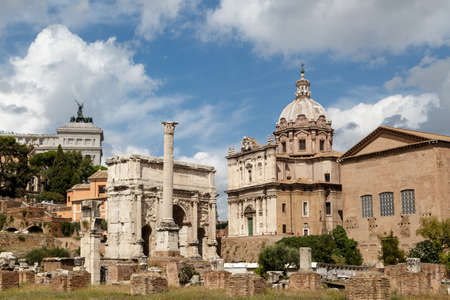 ROME, ITALY - SEPTEMBER 24, 2015 : View of the ancient church at Roman Forum, on cloudy blue sky background.のeditorial素材