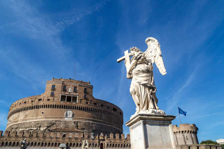 VÄ±ew of Castel Sant'Angelo, Castle of the Holy Angel built by Hadrian in Rome, with a sculpture, on bright blue sky background.のeditorial素材