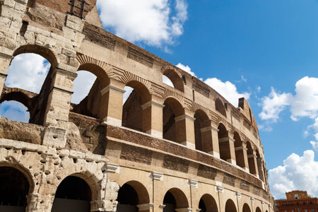 Close up detailed view of ancient amphitheatre of Colosseum built by Vespasian and Titus in Rome, on...