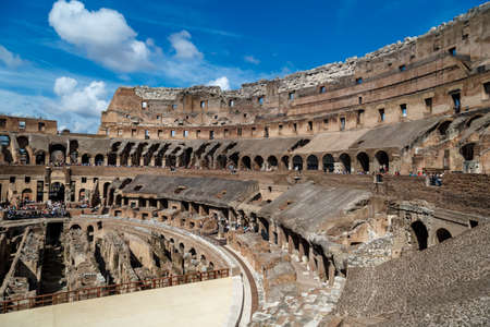 ROME, ITALY - SEPTEMBER 24, 2015 : Inside view of ancient amphitheatre of Colosseum built by Vespasian and Titus in Rome, on cloudy blue sky background.のeditorial素材