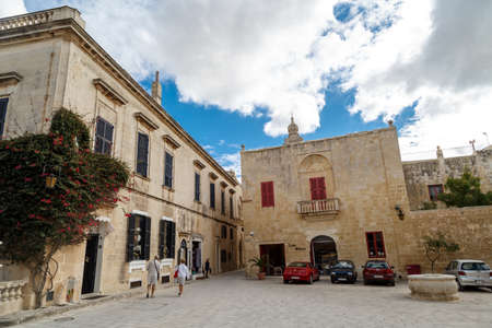 MDINA, MALTA - NOVEMBER 1, 2015 : View of Mdina streets with limestone historical buildings around, on cloudy sky background.のeditorial素材