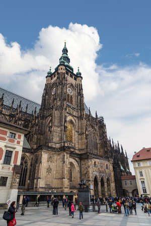 PRAGUE, CZECH REPUBLIC - DECEMBER 30, 2015 : Front view of historical gothic St. Vitus Cathedral in old town of Prague, found in 1344, on cloudy blue sky background.のeditorial素材
