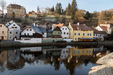 CESKY KRUMLOV, CZECH REPUBLIC - DECEMBER 29, 2015 : General view of Cesky Krumlov city with historical small houses along the river, on blue sky background.のeditorial素材