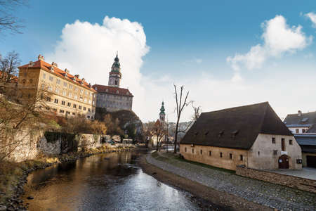 General view of Little Castle Tower in Cesky Krumlov, colorful historical tower on cloudy blue sky background.のeditorial素材